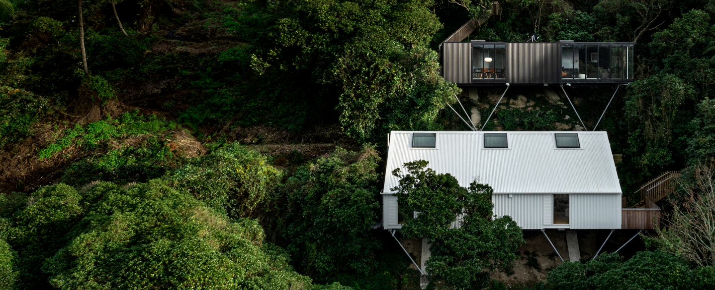 Modern home build on a forested hillside 